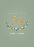 Christmas card with a gold script Joy cradled by eucalyptus